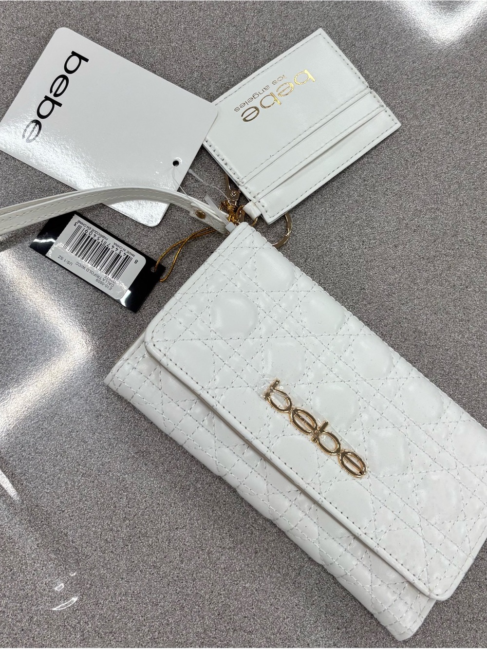 bebe White Quilted Wristlet with Gold Logo